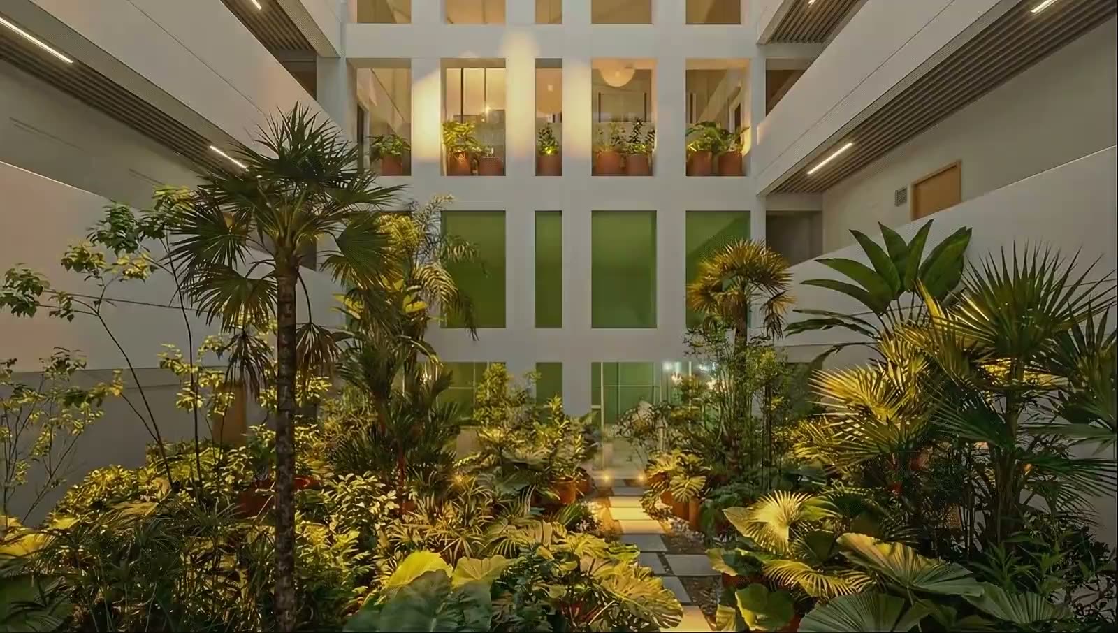 Atrio central de Henry — patio interior de luz natural cayendo por los niveles, render